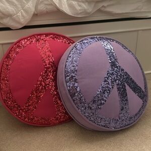 Adorable Pottery Barn Sequin Peace Pillows.
